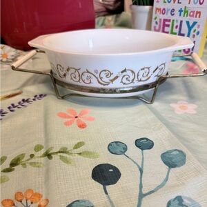 Pyrex White Vintage Casserole Dish with Gold Scroll Design and craddle